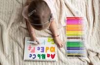 EAL Image of child writing letters